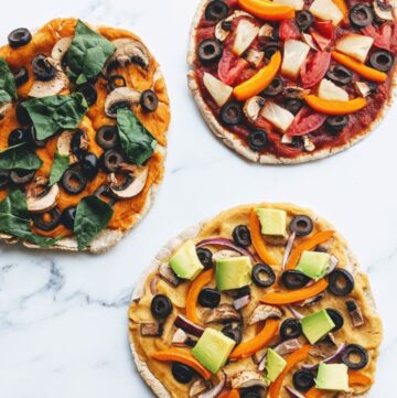 3 small pitas with different pizza toppings