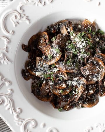 Mushroom slices in a white plate.