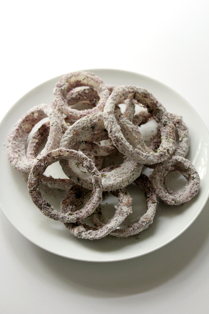 Blueish onion rings on a white plate