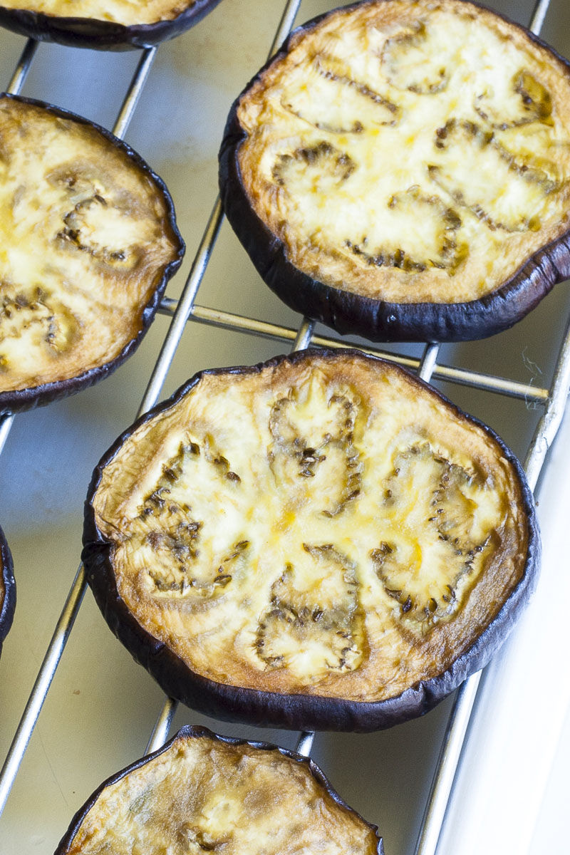 Eggplant slices on a grill rack up close