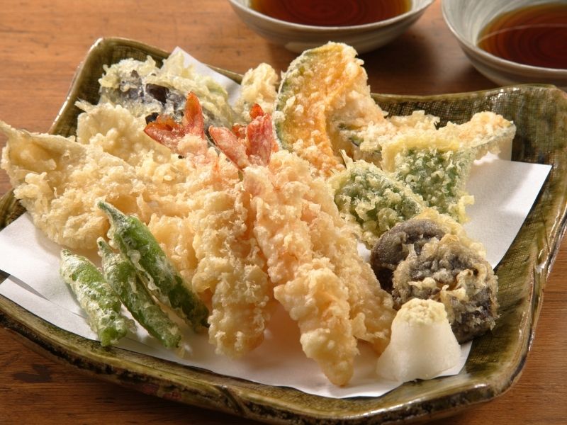 Different types of food breaded and deep-fried like shrimp, peppers, mushroom etc.