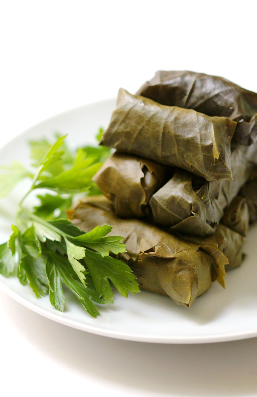 Vegan Rice Stuffed Dolmades | Strength and Sunshine @RebeccaGF666 A Mediterranean classic made vegan and gluten-free. Rice stuffed dolmades (grape leaves) full of fresh herbs, roasted eggplant, olives, spices, and aromatic basmati rice! A fantastic appetizer, side, or main dish!