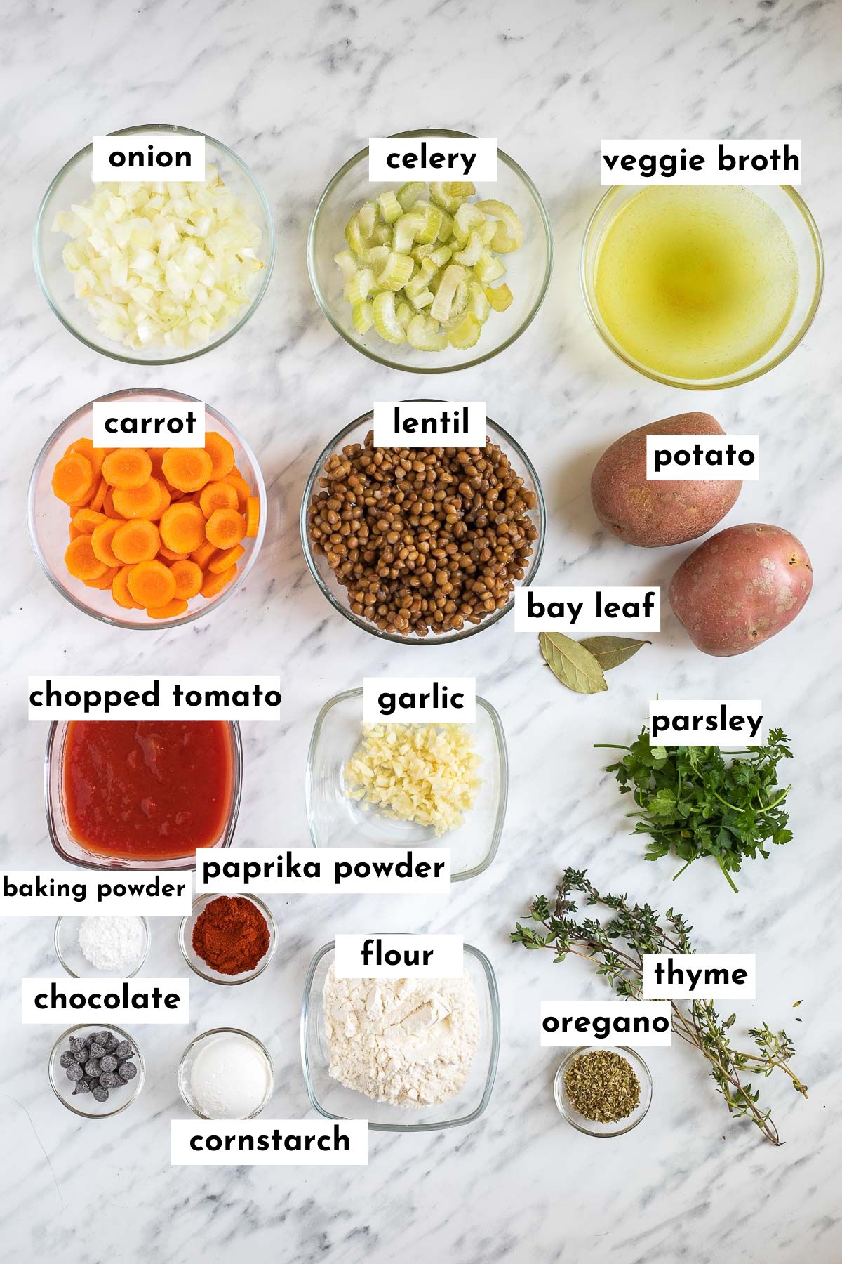 The ingredients of vegan stew with dumplings is placed in small glass bowls like