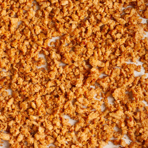 White frying pan with dark brown crumbles that reminds you of ground beef