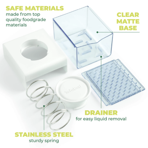 A box-style tofu press taken apart showing the lid, the container, the spring and other parts next to each other
